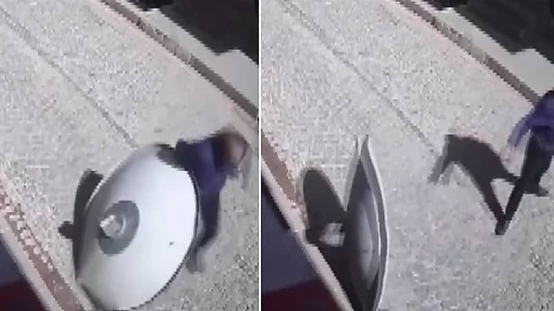 سقوط طبق قمر صناعي على رجل أثناء سيره في الشارع .. فيديو