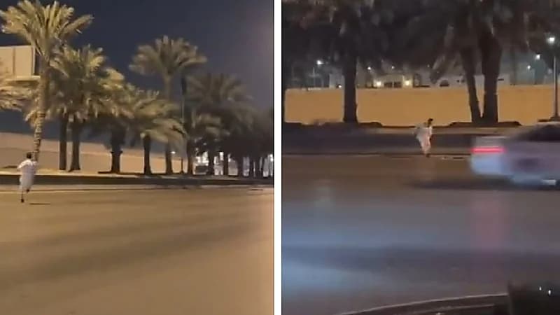 شاب يخاطر بحياته ليرفع العلم السعودي من وسط الطريق.. فيديو